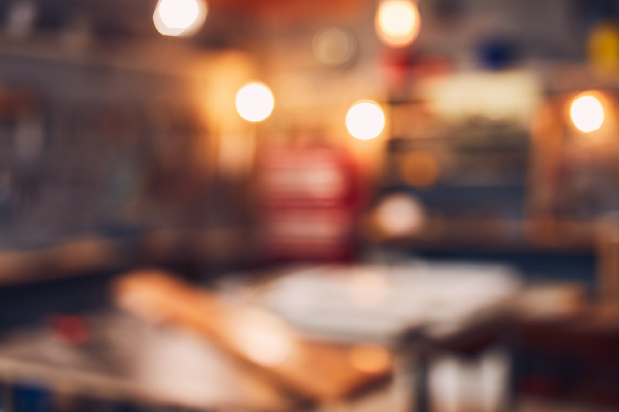 Blurred background image of a busy workshop.